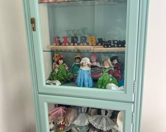 Blue display cabinet dolls