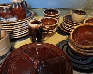 LOTS OF STONEWARE, AND THE BROWN DISH IN FOREFRONT ACTUALLY SITS ATOP A POINTED BROWN THING TO MAKE IT SPIN!!