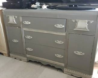 A unique, and versatile Vintage dresser / chest of drawers. A neutral distressed finish and whimsical hardware add to the desirability of the piece!
A versatile furniture item that can be used in many ways.