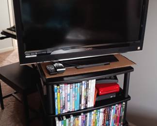 Two different large flat screen TV sets. Several DVD players. A hard to find VHS player. All in good condition.