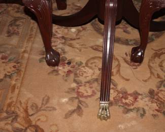 Chairs have ball claw feet and table has medal claw feet. 