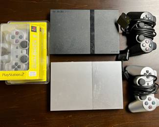 PlayStation 2 (one silver, one black)