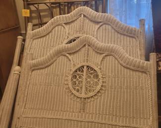 White wicker and brass bedframes