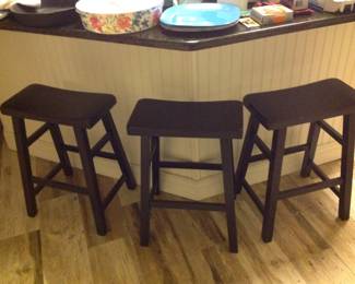 Three black bar stools