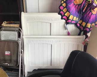 The head and footboard to the girls furniture .