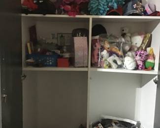 This closet contains, winter scarves, hats, gloves and mittens.
Ball caps, stuffed animals,
hair accessories, girl stuff,
Victoria Secrets-
panties, lingerie, stockinged
Spanx and more