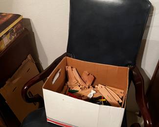 Toy wood train by Melissa and Doug
Navy leather and wood chair