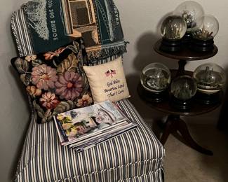 Slip covered chair, snow globes, tiered table