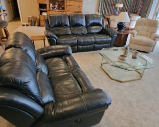 Power reclining black couch and loveseat