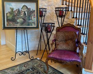 H.F. Dienst original oil, beautifully framed. Leather armchair and statement candelabras. 