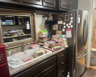 Mirror, dish towels, Samsung refrigerator 