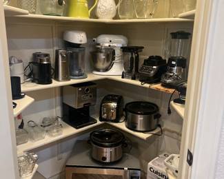 Kitchen Aid mixer, ninja blender, Nespresso coffee, panini press, crock pots, ice maker, Panasonic microwave, 
