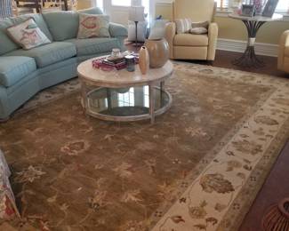 Beautiful rug is 10' x 14' in neutral tones