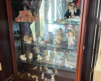 Wide curio cabinet with glass doors on both sides