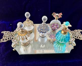 Perfume bottles on glass tray