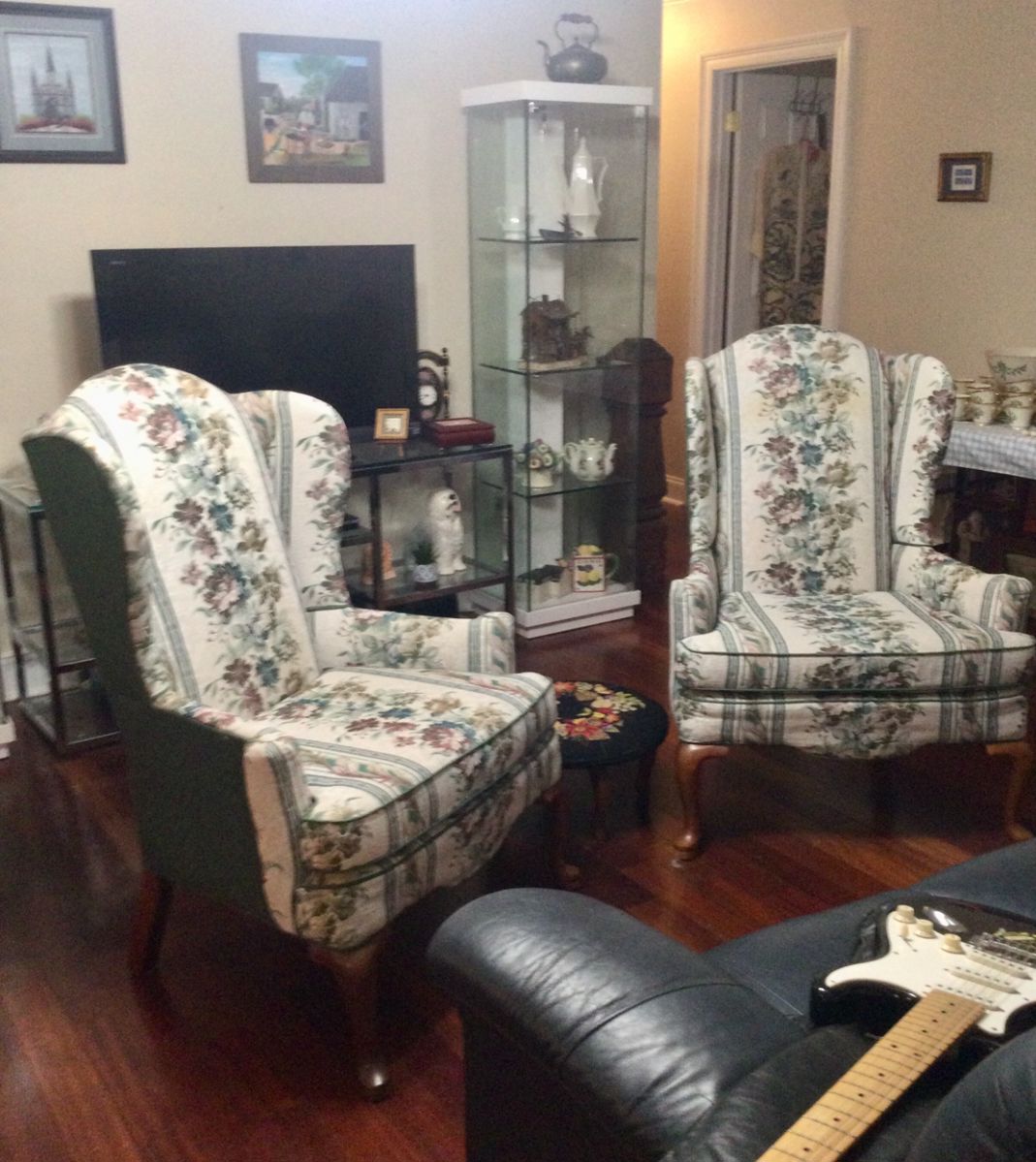 Pair of green floral arm chairs