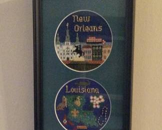 lots of needlepoint pieces hand done by homeowner