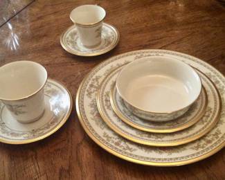 One of ten place settings of Lenox Castile Garden china