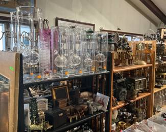 Family room is packed with collectibles - Wolfard oil lamps, Coleman lanterns, old fire extinguishers, antlers, hardware, collectibles, copper pots and pans, and more!