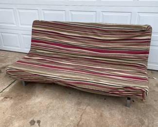 $50 Futon                                                                                         
Nice futon with metal frame and mattress 
76 1/2” long
49 1/2” wide
The black material that covers the base has a tear. Please see pictures 