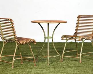 A three piece French wrought iron garden bistro set
Arras
early 20th century