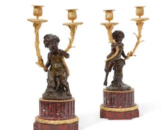 A pair of Louis XVI style gilt and patinated bronze and rouge griotte marble figural two light candelabra
late 19th/early 20th century