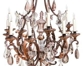 A Louis XV style gilt and ebonized iron and clear and colored glass twelve light chandelier
20th century