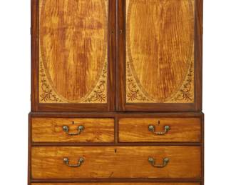 A George III inlaid mahogany, satinwood, and penwork decorated linen press
in the manner of John Linnell
circa 1770