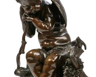 A Continental patinated bronze model of a seated Cupid with doves
late 19th/early 20th century