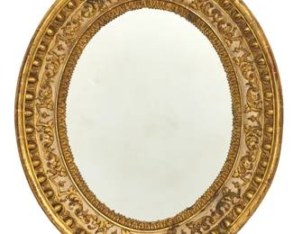 An Italian Neoclassical parcel gilt and white painted oval mirror
early 19th century