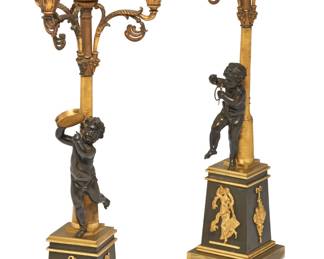 A pair of Empire style gilt and patinated bronze figural four light candelabra
late 19th/20th century