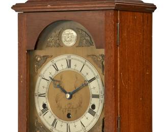 A George III style quarter chiming mahogany mantel clock
Elliott
20th century