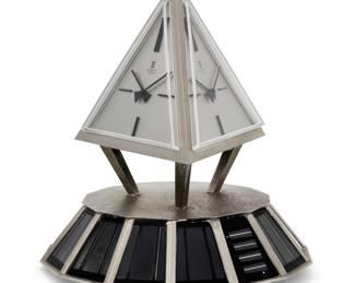 A Swiss solar powered three dial rotating pyramid table clock
Montre Royale, Geneva
modern