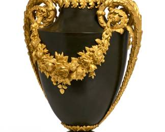 A large Louis XVI style gilt and patinated bronze urn
20th century