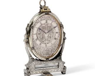 A fine Victorian engraved sterling silver and silver gilt travel strut clock in fitted case
in the manner of Thomas Cole; retailed by Hunt & Roskell, London
1850