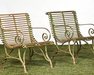 A pair of French wrought iron garden armchairs
Arras
early 20th century