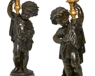 A pair of Louis XVI style parcel gilt and patinated bronze models of putti
late 19th century