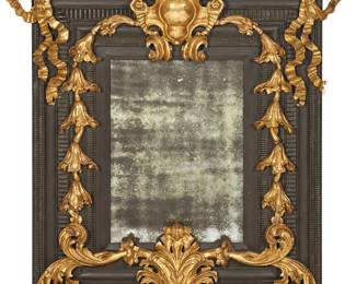 An imposing Continental Baroque style carved giltwood and paint decorated mirror
possibly Quatrain
modern