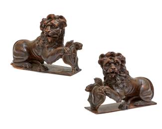 A pair of Continental stained oak models of recumbent heraldic lions
probably Dutch
fourth quarter 17th century