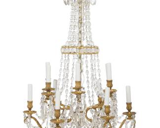 A Louis XVI style gilt bronze cut and beaded glass twelve light chandelier
