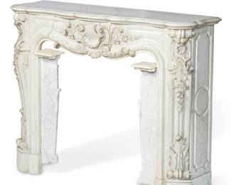 A Continental Baroque style carrara marble fire surround
20th century