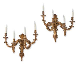 A pair of Italian Baroque giltwood four branch wall lights
mid 18th century