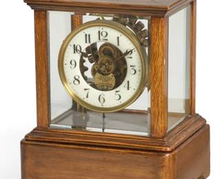 A Eureka Clock Co electric clock in oak case
early 20th century