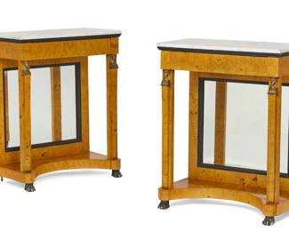 A pair of Continental Neoclassical style gilt bronze mounted parcel ebonized burr birch console tables
20th century