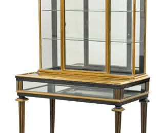 A French brass mounted ebonized vitrine cabinet
late 19th/early 20th century