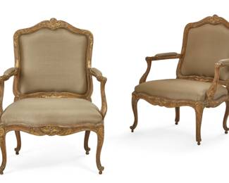 A pair of Louis XV style parcel gilt walnut armchairs
late 19th century