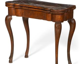A Continental Rococo walnut fold top card table
mid 18th century