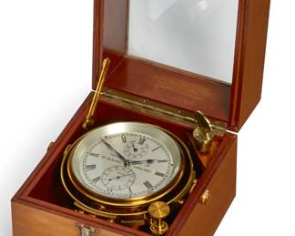 A Thomas Mercer Ltd. lacquered brass two day marine chronometer in walnut case
Numbered 16700
20th century