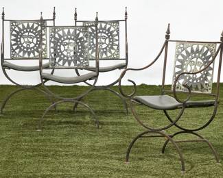 A set of four whimsical cast iron garden armchairs
20th century