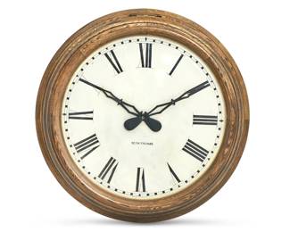 A large Seth Thomas oak circular wall timepiece
early 20th century